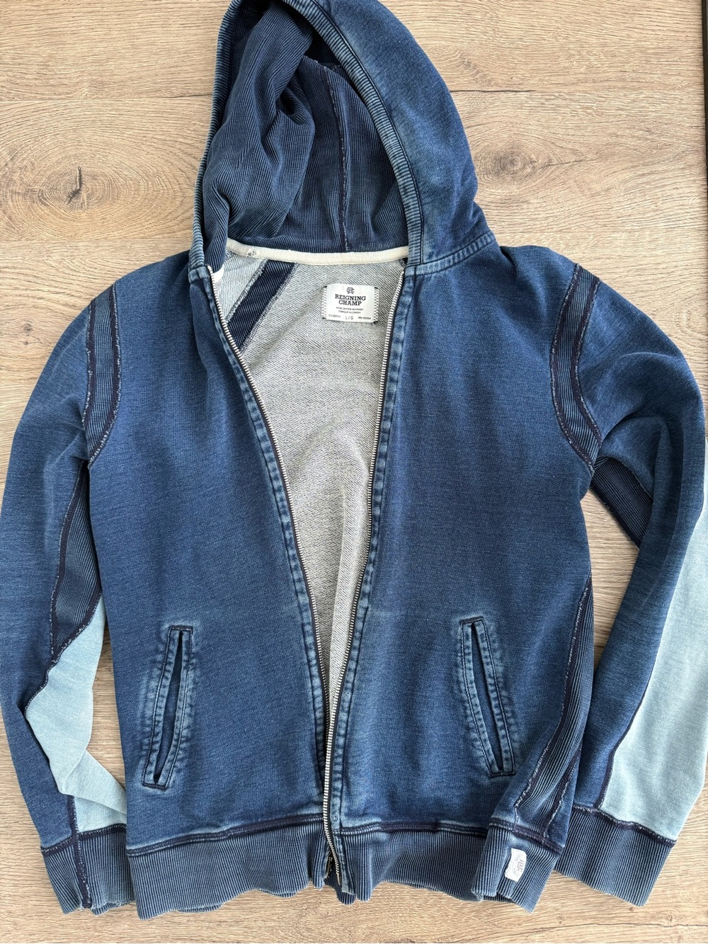 Reigning Champ in two blue zip hoodie